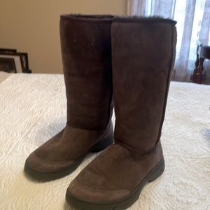 New UGG brown boots. Beautiful stitching up back, fur lined inside, rubber sole
